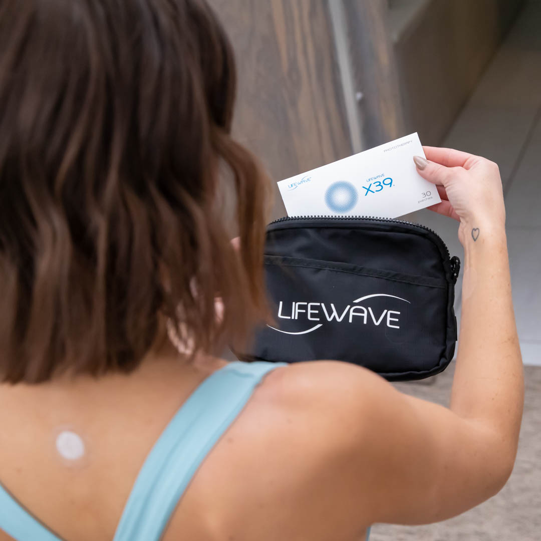 Woman examining Lifewave product package